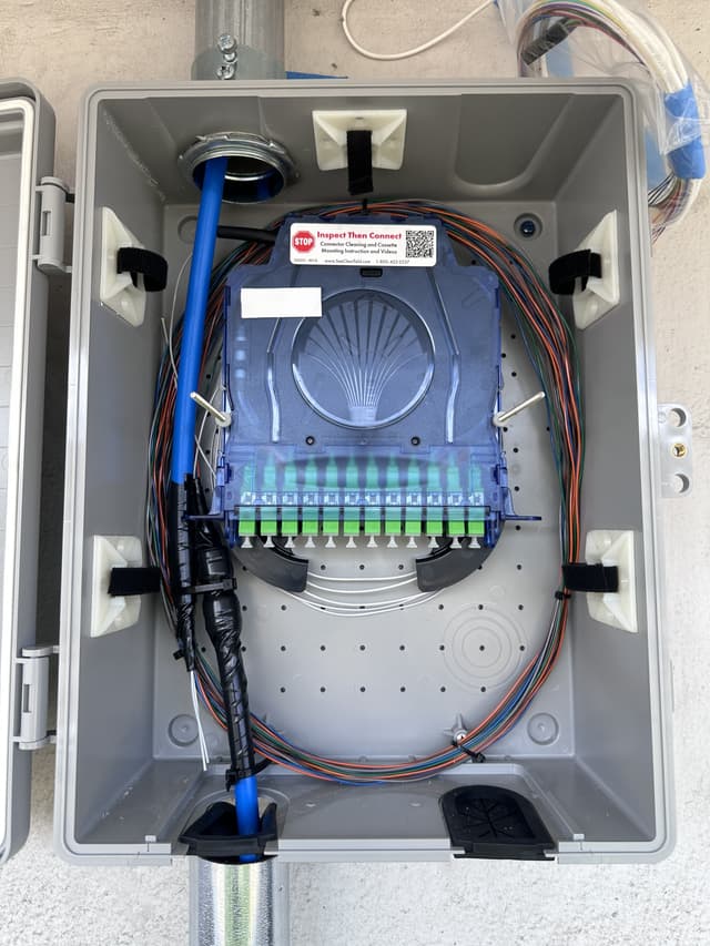Clearfield wall-mount fiber enclosure installation